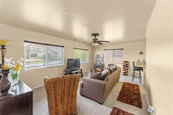 Second-floor living room with natural light and views.
