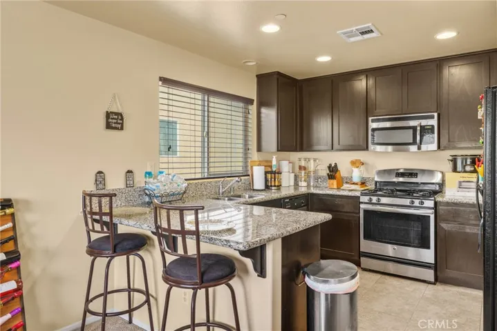 Spacious kitchen featuring an abundance of counter space, premium cabinetry, and an open layout.