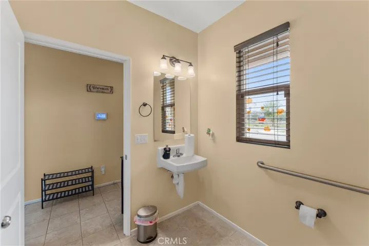 Main floor half bath with ADA-compliant features.
