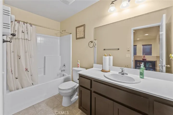 Spacious bathroom offering a convenient shower/tub combination.