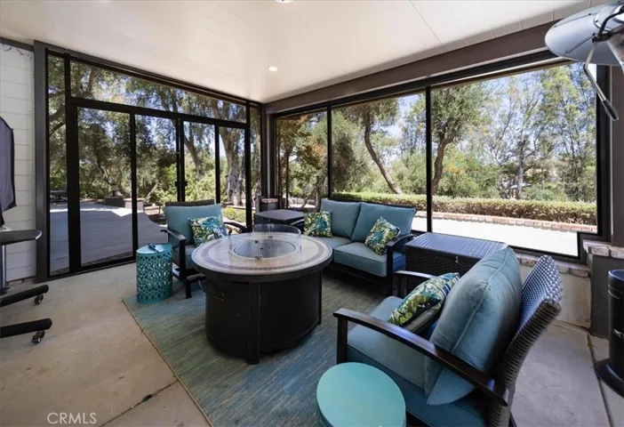 Downstairs wrap around enclosed patio