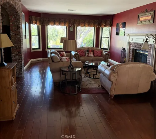 Dining is open to Family Room with fireplace and view
