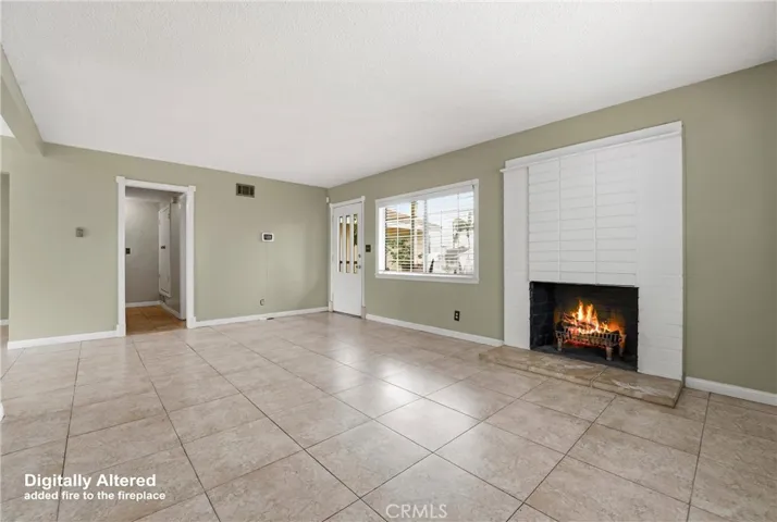 The way lovely, light, open and bright living room would look with  fireplace on.