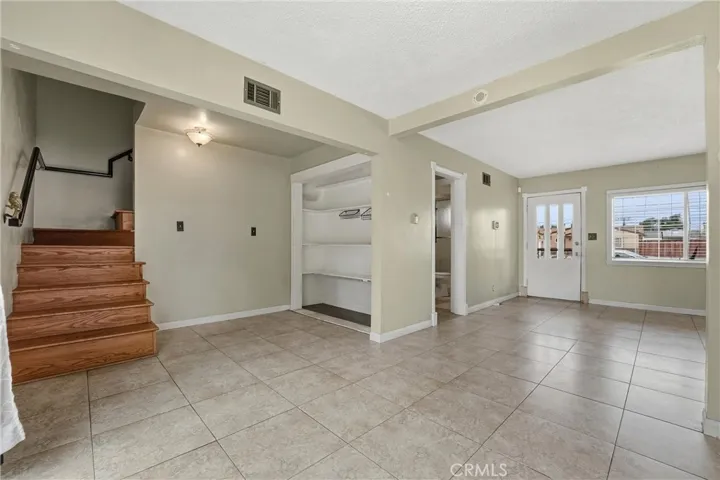 Indoor wood staircase to go upstairs with high ceiling