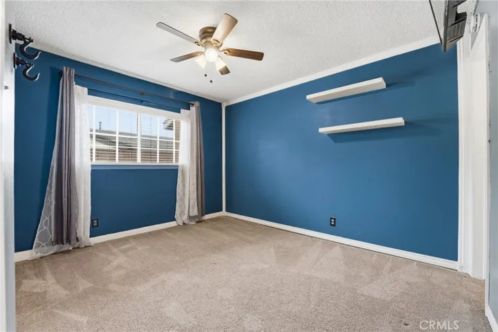 Welcoming and cozy bedroom with energy-efficient fan for airy feel