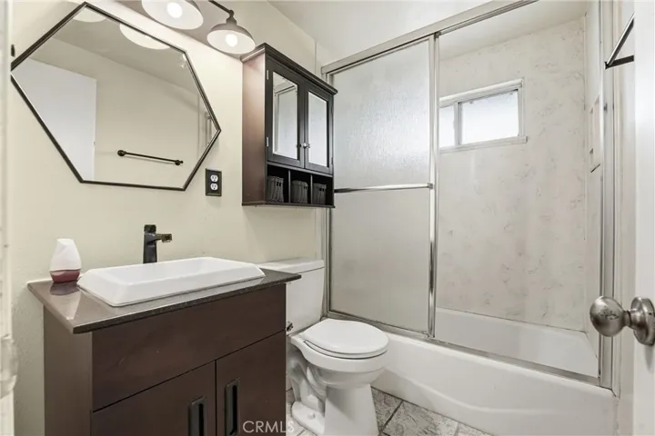Downstairs bathroom with tub and shower