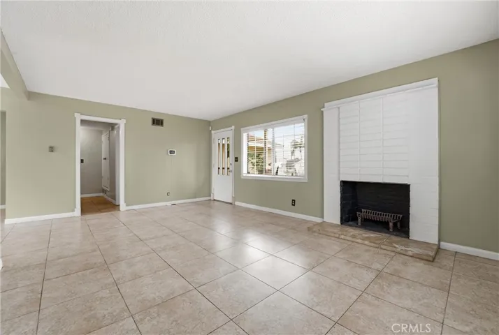View of entrance and hallway to 2 bedrooms and 1.5 bathrooms