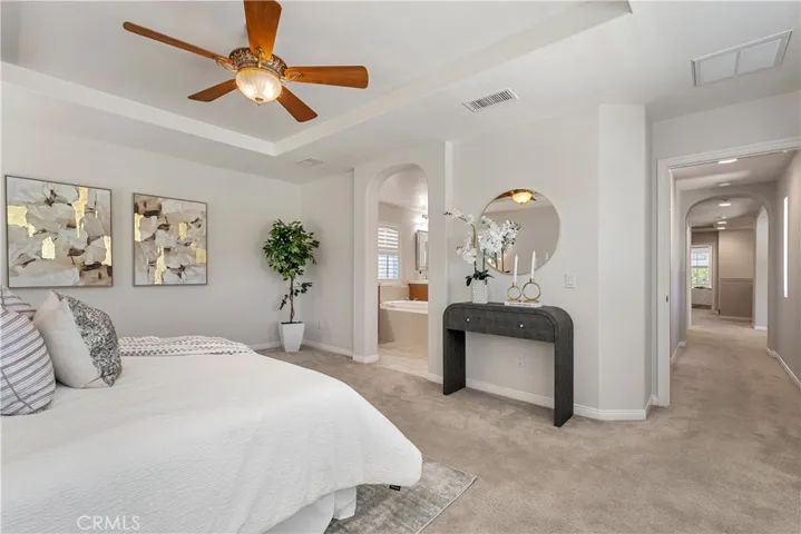 Primary bedroom is a generous 18' x 15'8" (approx)