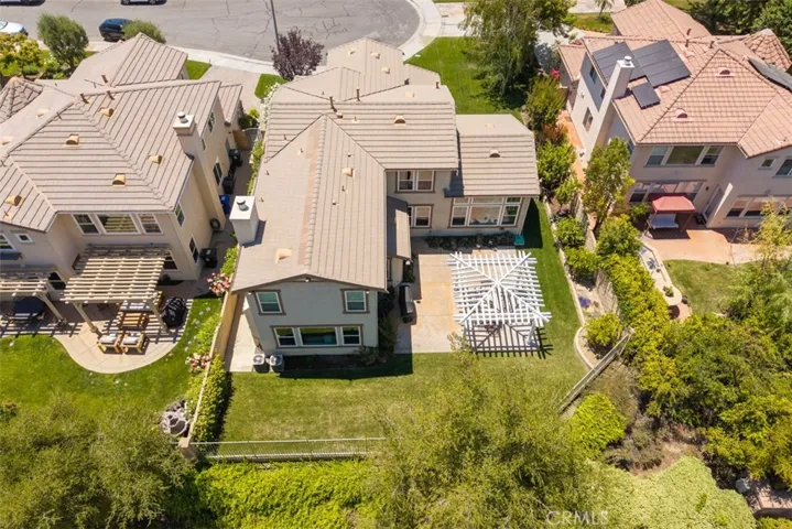 Aerial view. Backyard includes orange and lime trees.
