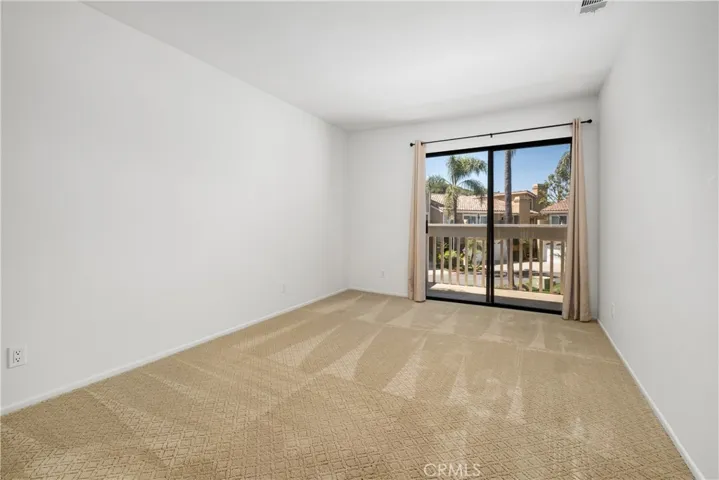 Secondary bedroom w/ balcony