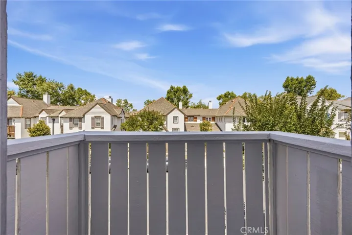 Scenic view from the second bedroom balcony featuring open blue skies