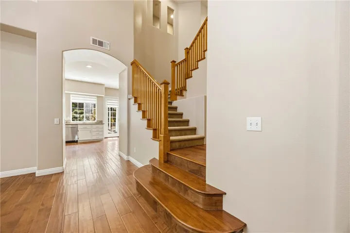 Elegant staircase with beautiful wooden steps leading to the second floor