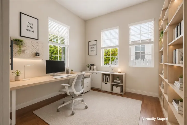 Dedicated home office with abundant natural light, perfect for remote work. (Virtually Staged)