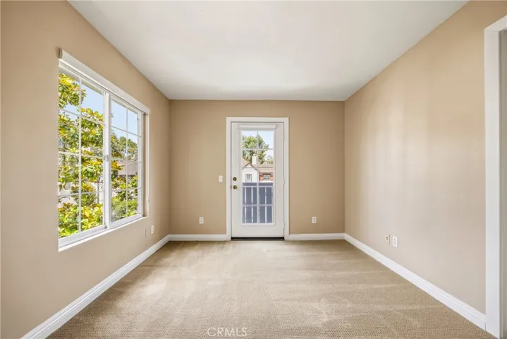 Versatile third bedroom featuring direct access to a private balcony