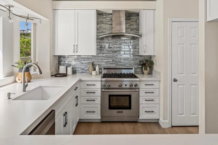 Upgraded soft-close cabinets, subtle quartz counter tops, Miele, Thermador stainless appliances