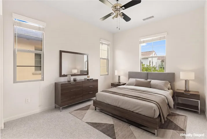 Virtually staged secondary bedroom showcasing flexible space for guests, family, or home office use.