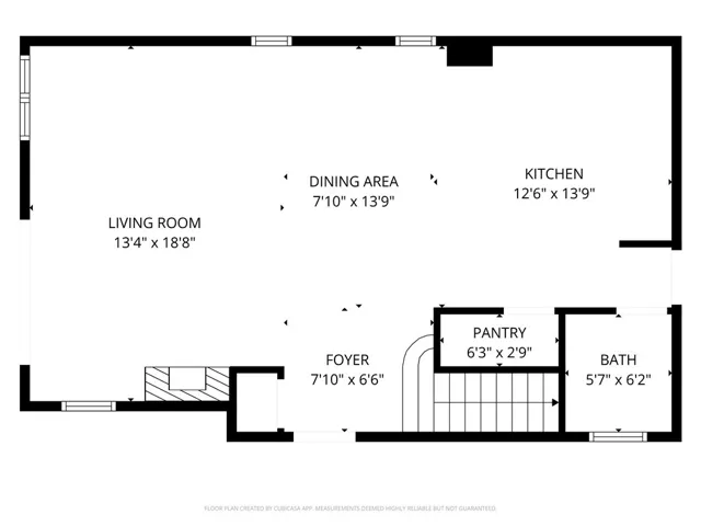 Open concept main level featuring seamless living, dining, and kitchen flow with convenient pantry and guest powder room