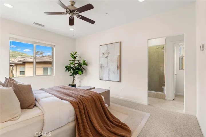 Light filled primary retreat offering generous proportions and seamless access to the ensuite bath and walk in closet.