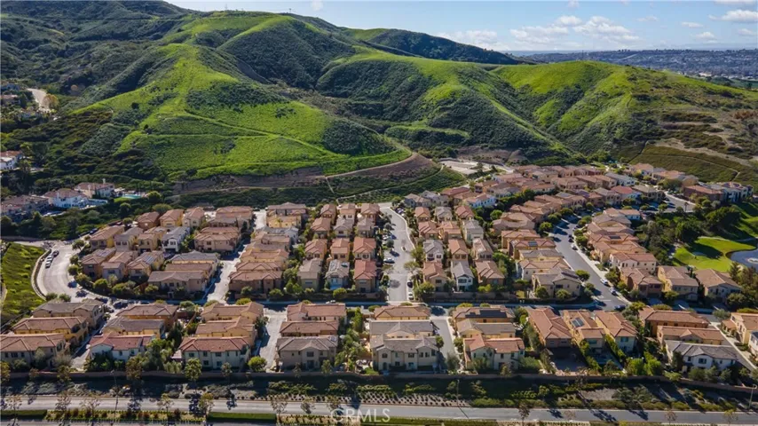 Set against a picturesque hillside backdrop offering a peaceful residential setting and natural surroundings.