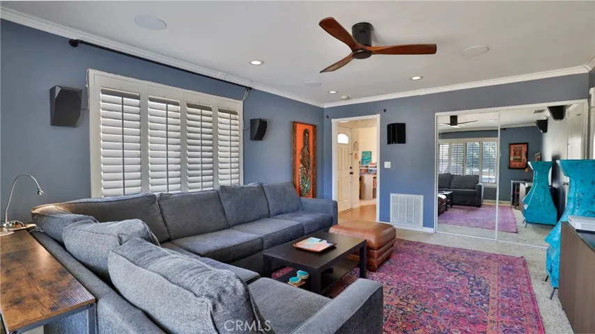 Family room also has a mirrored closet that is large enough for the heater, water heater and storage.