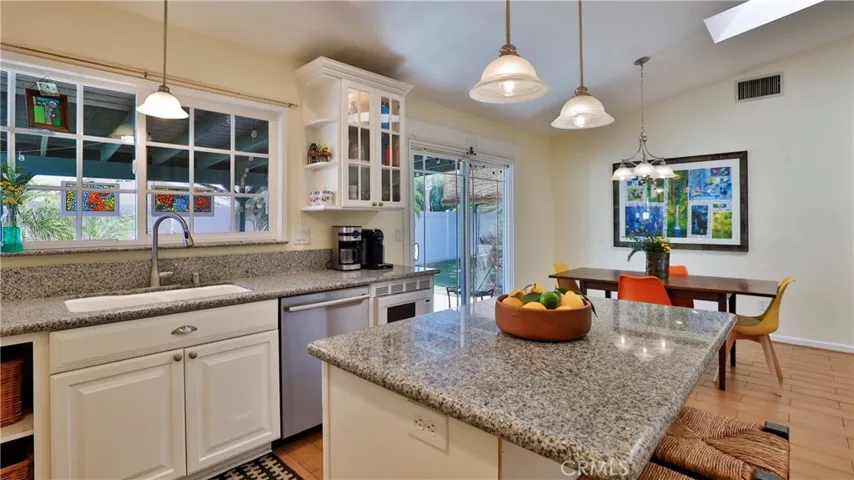 Under counter lighting and pendant lighting give you plenty of light but the large window over the sink also gives you natural lighting