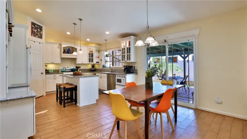 Let's all go to the kitchen! Features: dining area for eating, ceramic tiled flooring, pendant lights and can lighting