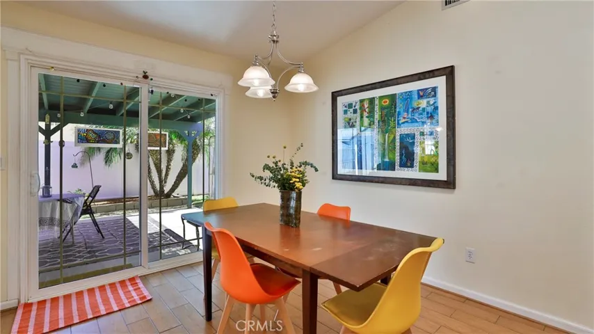 Dining area has a slider that leads out to the beautiful back yard