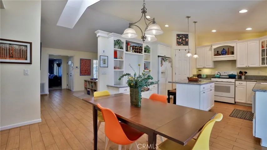 Very open concept with the skylight above, giving tons of natural lighting, and room for all in the dining/kitchen area.