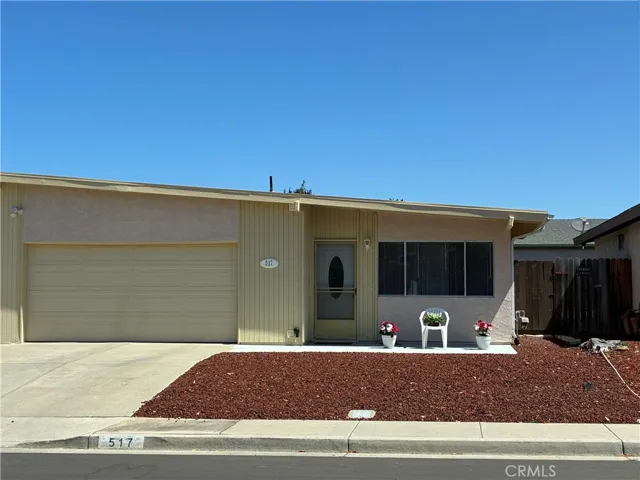 Beautifully well kept home with easy care yard front and back.
