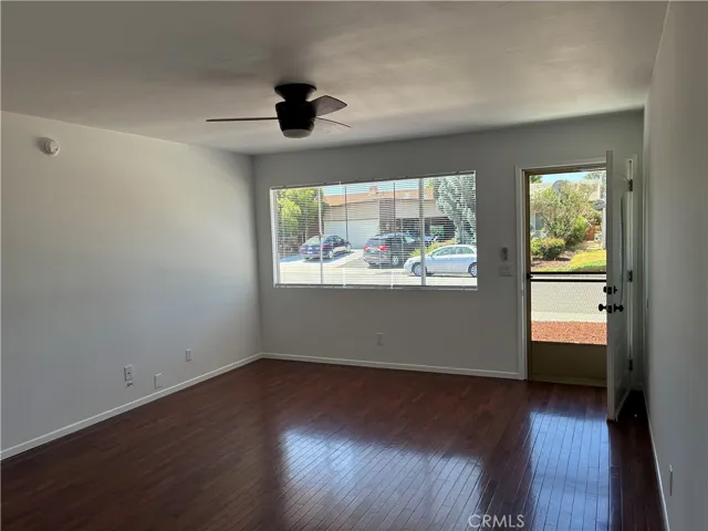 Living room has gorgeous flooring, freshly painted, ceiling fan & new blinds. The floor plan is open and airy throughout.