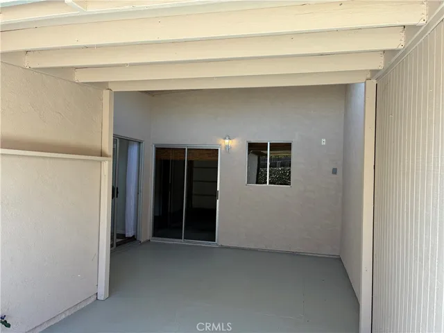 Back yard patio area. Doors access the garage and the home. Perfect for folks who like to spend time outdoors!!