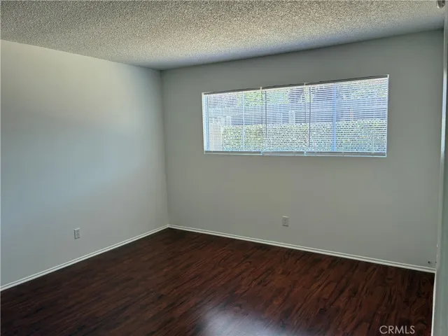 Good sized master bedroom has a big window to let the morning sun in through the new blinds and look out into the back yard. Beautiful flooring, a big wardrobe closet with extra shelving.