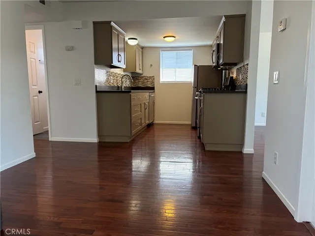 Kitchen from the dining area and around the corner to the living room.