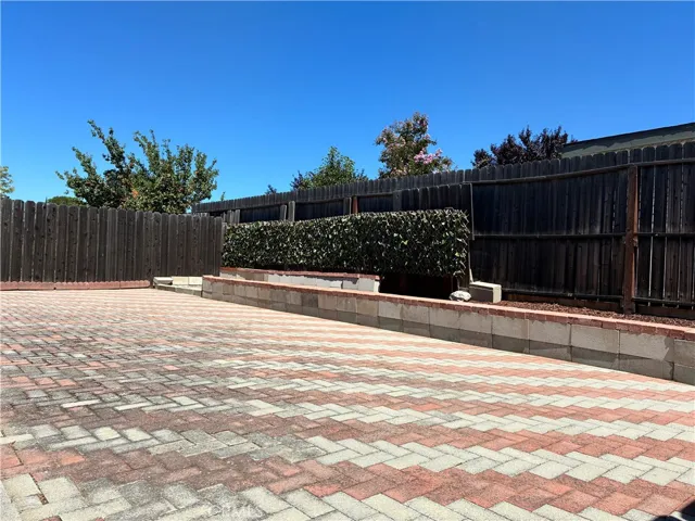 Low maintenance yard with privacy fencing surrounding.