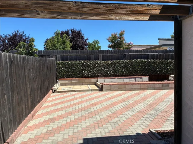 Low maintenance yard with privacy fencing surrounding.