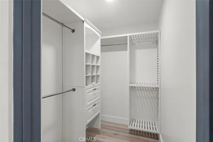 Walk in closet with built-ins.