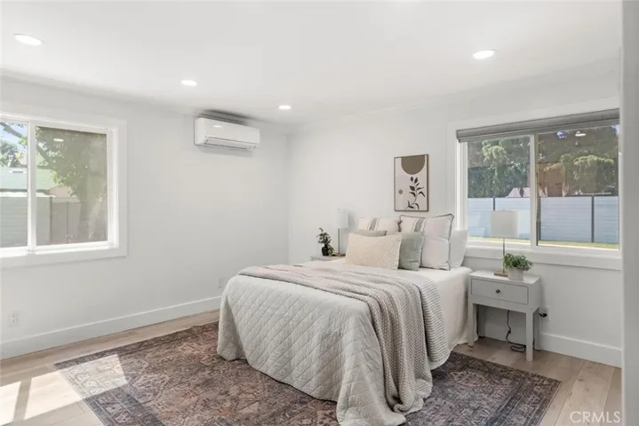 Mini primary bedrom with mini-split.