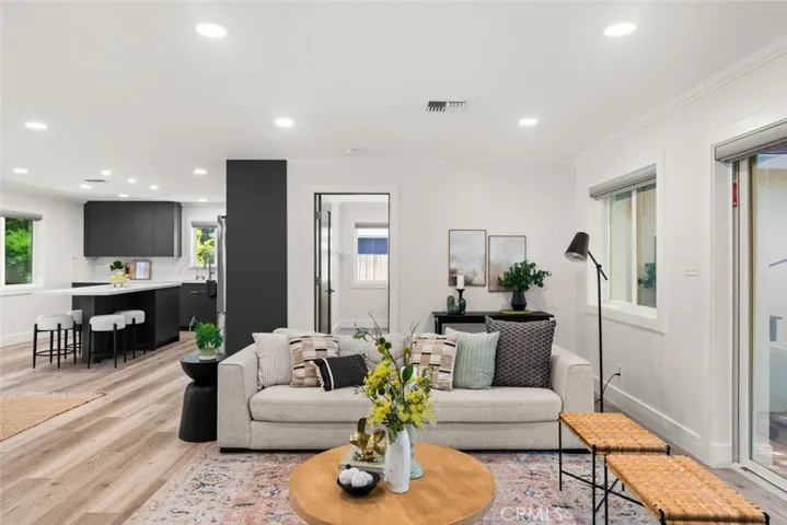 Recessed lighting and LVT throughout home.