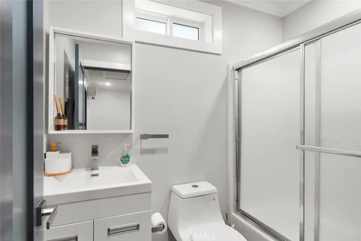 Bath with shower/tub combo.