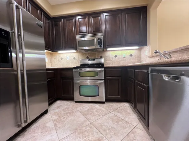 kitchen with newer range/stainless equipment
