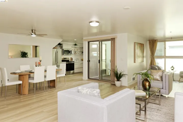 Living room featuring light wood-style floors and ceiling fan