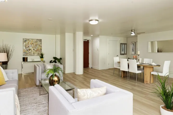 Living room featuring light wood finished floors and ceiling fan