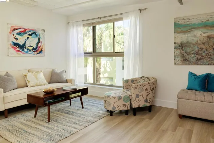 Living room featuring wood finished floors and baseboards