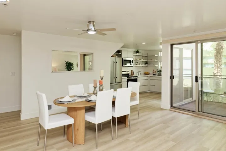 Dining space featuring light wood finished floors, ceiling fan, and recessed lighting
