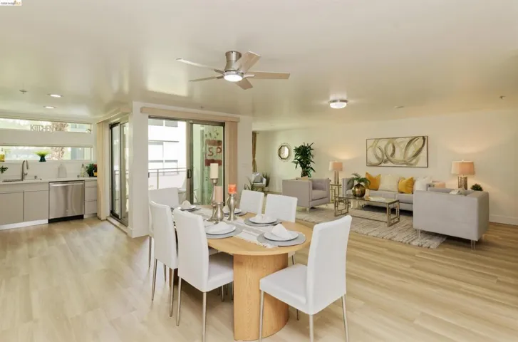 Dining space with ceiling fan, light wood finished floors, and recessed lighting
