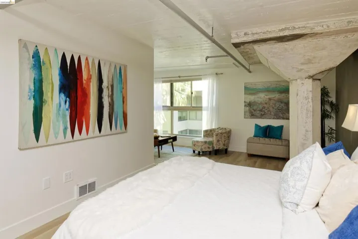 Bedroom featuring wood finished floors and baseboards