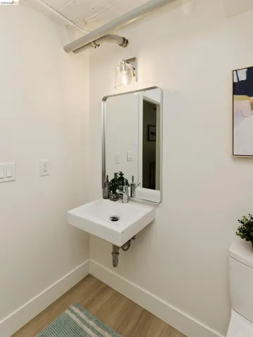Bathroom featuring light wood finished floors and baseboards