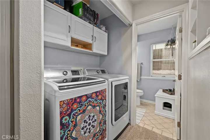 Laundry area and half bathroom downstairs