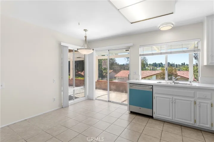 Breakfast nook space which is step away from sliding door leading to patio