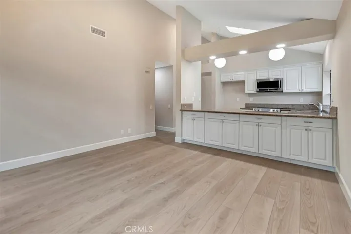 FRIG INCLUDED - old photo - Family room view towards kitchen - lots of storage!